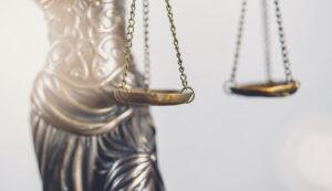 Legal law concept image, abstract close up detail of scales of justice.